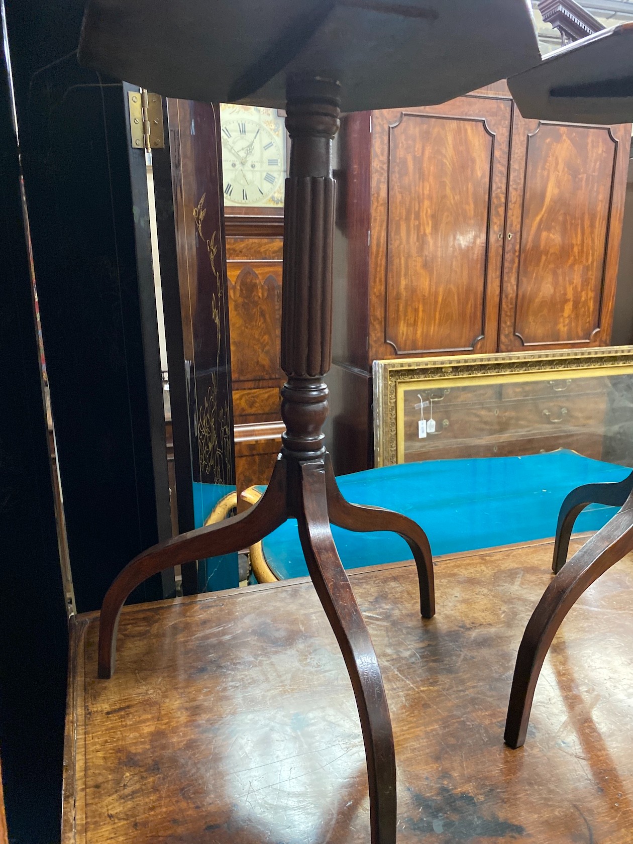 A pair of Regency style octagonal mahogany wine tables, width 40cm, height 70cm